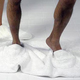 Illustration for article titled Bathmat Slippers Prevent Wet Bathroom Tiles